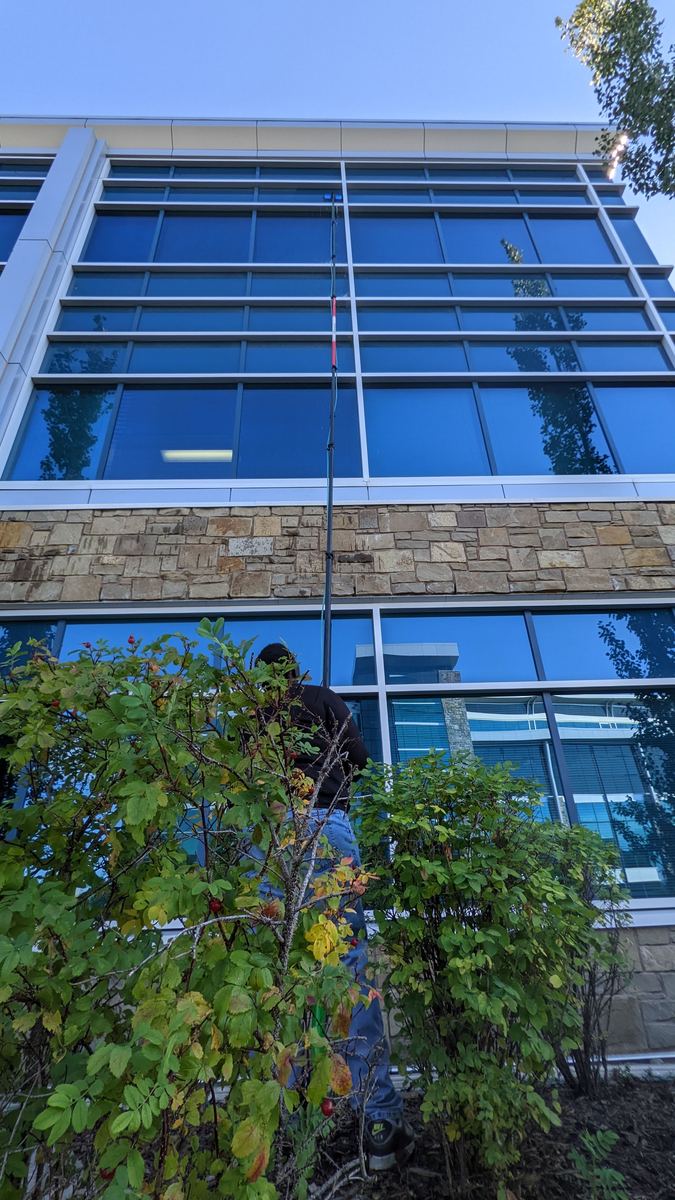 High-rise window cleaning with water-fed pole, Calgary