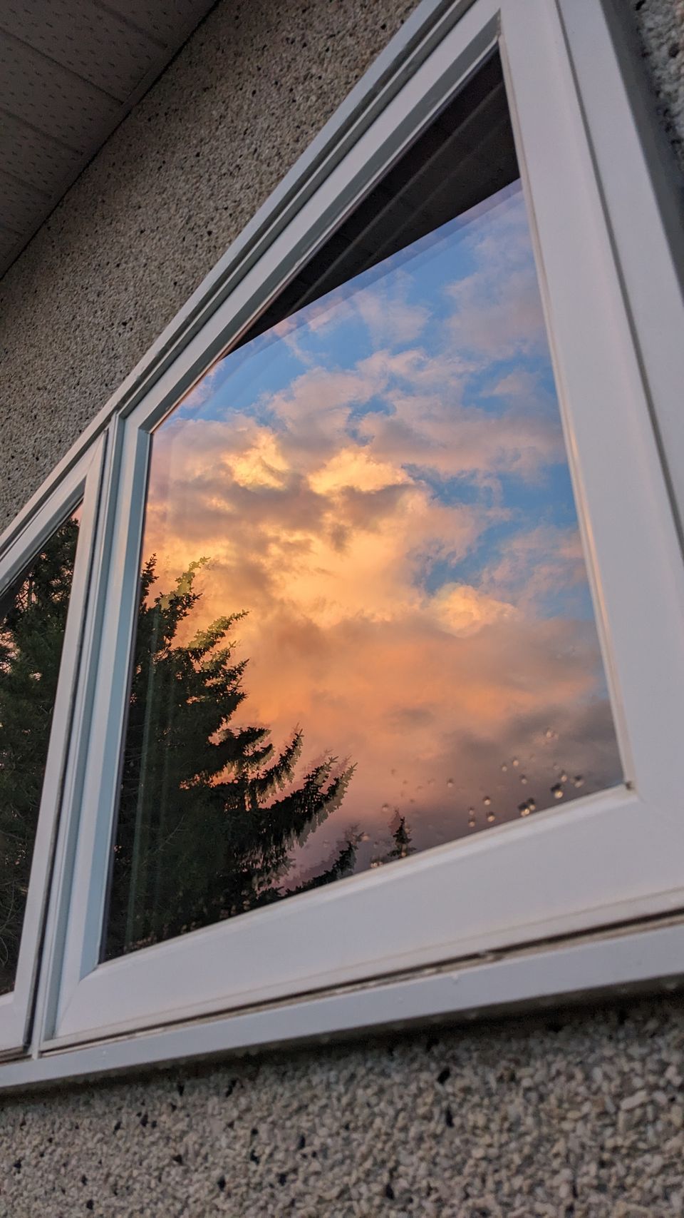 Calgary sunset reflected in freshly cleaned window glass