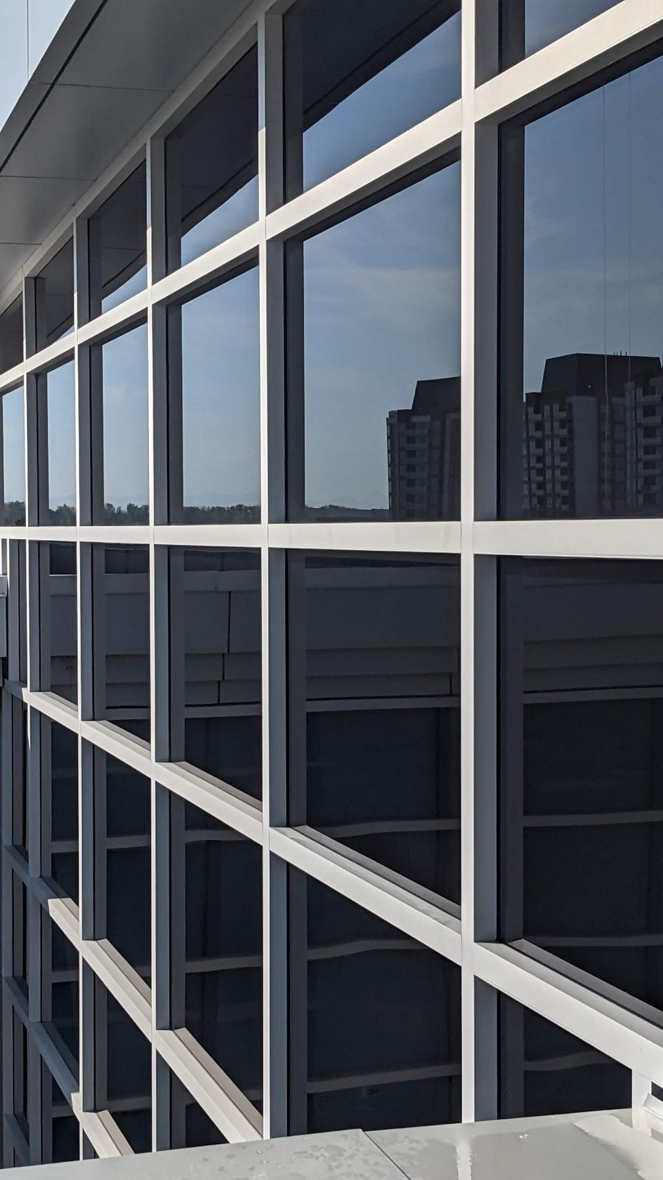 High-rise curtain wall glass cleaned, Calgary commercial building