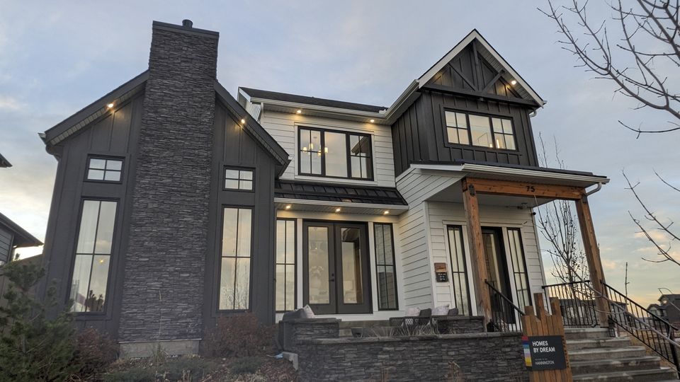 Single-family Calgary home with freshly cleaned windows at dusk