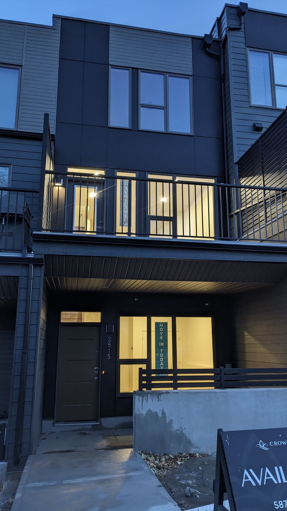 Modern Calgary townhome with clean windows at twilight